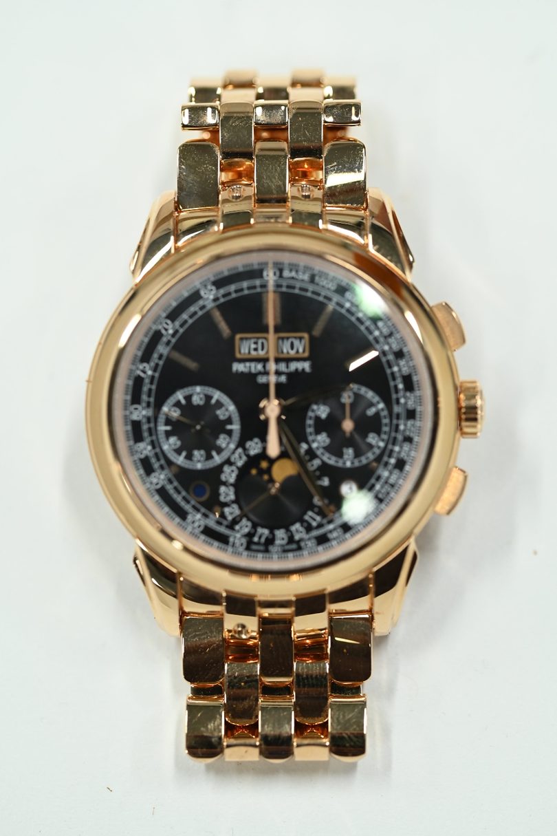Patek Philippe 5270 perpetual calendar chronograph in rose gold with black dial, moonphase and integrated gold bracelet