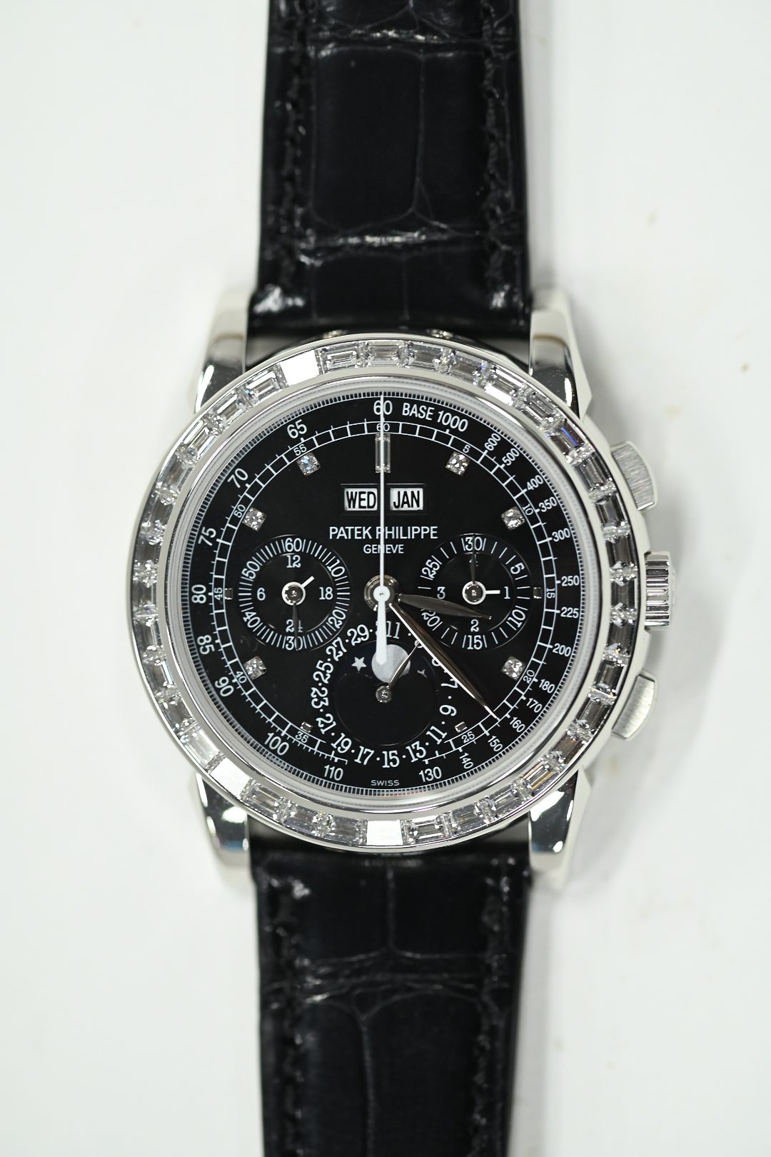 Patek Philippe perpetual calendar chronograph with black dial, baguette diamond bezel and diamond hour markers on black alligator